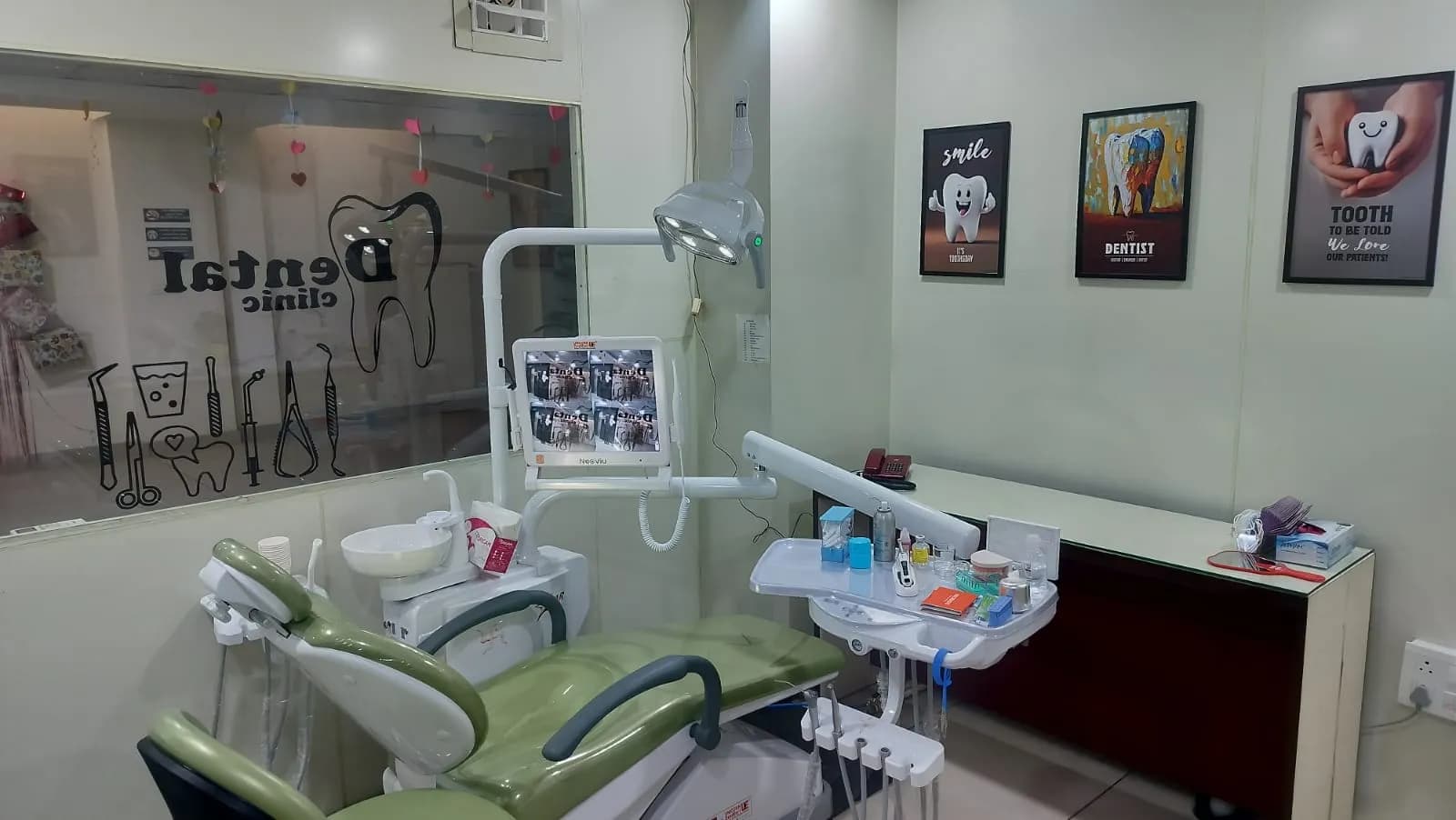 The treatment room seen from the doorway, with the chair on the left and the counter running along the wall.